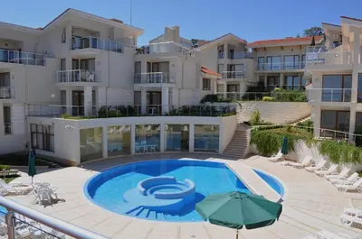 a swimming pool in front of a building at Wonderful family villa with sea view in Byala