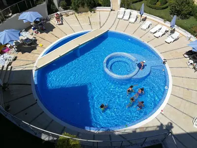 an overhead view of people in a swimming pool at Wonderful family villa with sea view in Byala