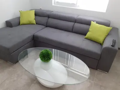a living room with a couch and a glass table at Varna beach in Varna City