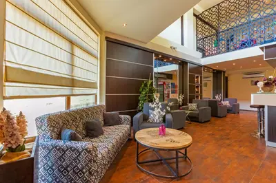 a lobby with couches and a table at Hotel Julia in Sveti Vlas