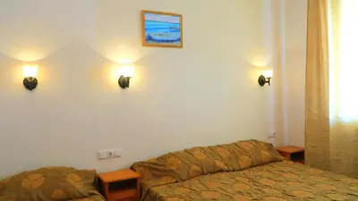a living room with a couch and lights on the wall at Bisser Obzor in Obzor