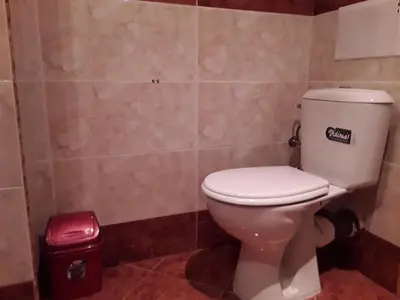 a bathroom with a white toilet in a room at FORT NOKS NESSEBAR B2-203 Private Studio Sunny Beach in Sunny Beach