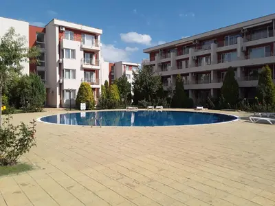 a swimming pool in front of a building at FORT NOKS NESSEBAR B2-203 Private Studio Sunny Beach in Sunny Beach