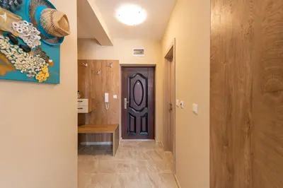 a hallway with a door in a house at Aquamarine in Pomorie