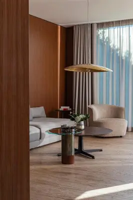 a living room with a couch and a table at Vaya Beach Resort in Emona