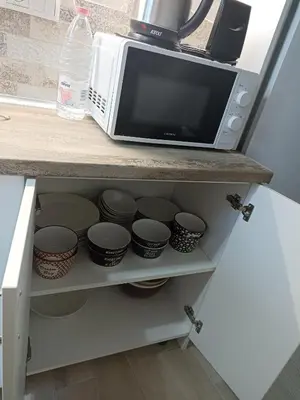 a microwave oven sitting on top of a kitchen counter at Apartment SEA HOLIDAYS in Burgas City