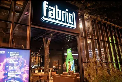 a restaurant with a sign on the front of it at ART LUXURY Apartment in Burgas City
