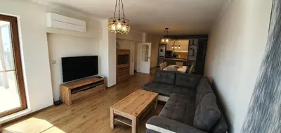 a living room with a couch and a tv at CENTRAL Lux Apartment in Varna City