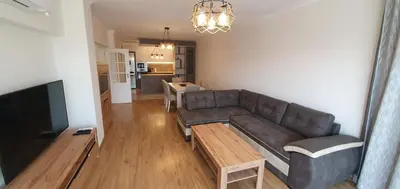 a living room with a couch and a table at CENTRAL Lux Apartment in Varna City