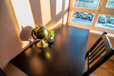 a dining room table with a globe on top of it at LunApart in Varna City