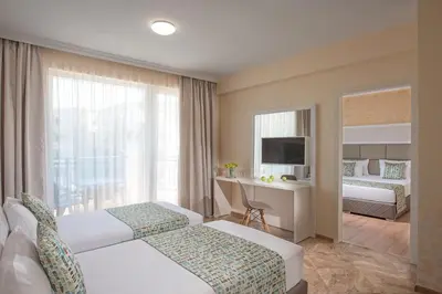 a hotel room with two beds and a desk at Marina Sands Bijou Boutique - excellent choice for travelers visiting Obzor 2-4p in Obzor