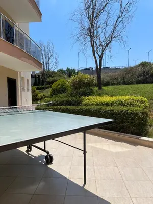 a ping pong table in front of a building at Villa Orange in Sozopol