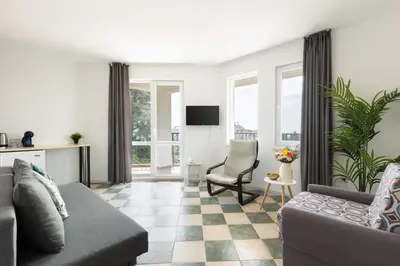 a living room with a couch and a chair at VILLA SOL in Sunny Beach