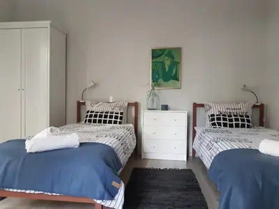 a bedroom with two twin beds and a dresser at Flat in Varna, central location, close to beach in Varna City