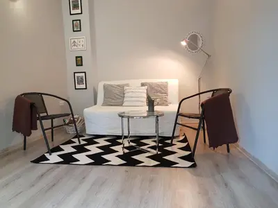 a room with a bed and a table and a bed at Flat in Varna, central location, close to beach in Varna City