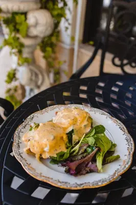 a sandwich on a plate on a table at Royal Hotel in Varna City