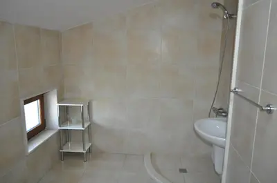 a bathroom with a toilet and a sink at Beautiful family villa with sea view in Byala