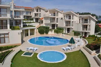an image of an apartment complex with a swimming pool at Beautiful family villa with sea view in Byala
