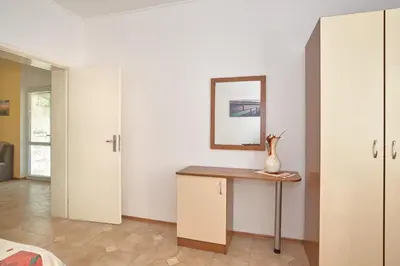 a room with a desk and a mirror at BulgariaVilla - Green Life Villas in Bryastovets