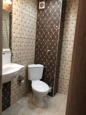 a bathroom with a toilet and a sink at Апартамент Анели in Pomorie