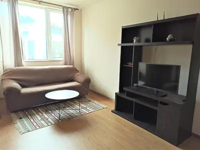 a living room with a couch and a flat screen tv at Apartment Relax Lozenets in Lozenets