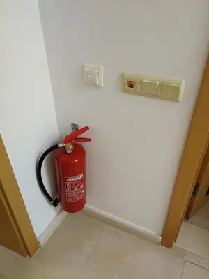 a fire hydrant in the corner of a wall at Cozy family villa 500m. from the beach in Byala