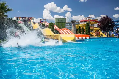a water park with a slide in the water at Aqua Nevis Hotel & Aqua Park - All Inclusive in Sunny Beach