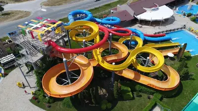 an aerial view of a water park with a water slide at Aqua Nevis Hotel & Aqua Park - All Inclusive in Sunny Beach
