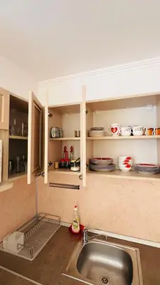 a kitchen with a sink and a counter top at Villa CALABRIA in Sveti Vlas