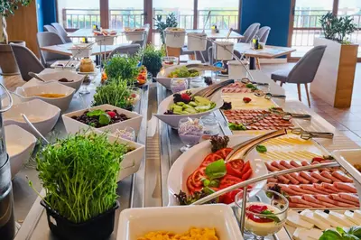 a buffet line with many different types of food at Viva Mare Beach Hotel by Santa Marina in Sozopol
