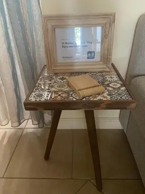 a small table with a box on top of it at Tiny Bijou Sea View studio - Santa Marina - Sozopol in Sozopol