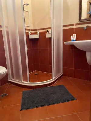 a bathroom with a shower and a sink at Tiny Bijou Sea View studio - Santa Marina - Sozopol in Sozopol