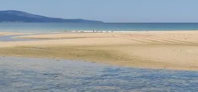 a sandy beach with a body of water at Dimi's River Park in Sunny Beach