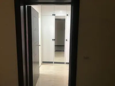 an open door to a hallway with a mirror at Relax Apartment am Südstrand in Primorsko