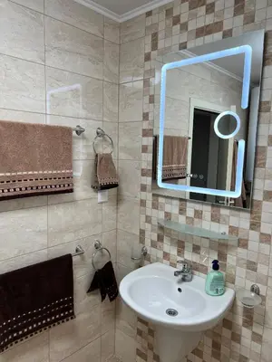 a bathroom with a sink and a mirror at Relax Apartment am Südstrand in Primorsko