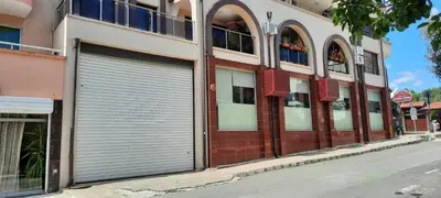 a building with two garage doors on a street at Relax Apartment am Südstrand in Primorsko