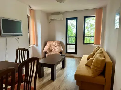 a living room with a couch and a table at Sozopol Dreams - Apartment №41 in Sozopol