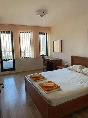 a bedroom with a bed with two towels on it at Sozopol Dreams - Apartment №41 in Sozopol