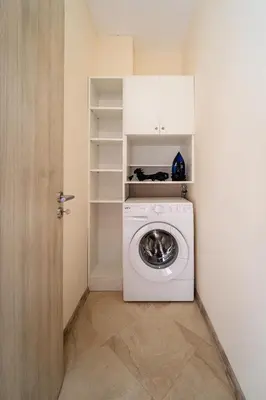 a white washer and dryer in a room at Summertime in Varna South Bay Beach Residence in Varna City