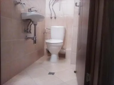 a bathroom with a toilet and a sink at Silver Beach A98 in Byala