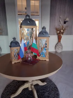 a table with two lanterns on top of it at Messembria Palace Bulgaria in Sunny Beach