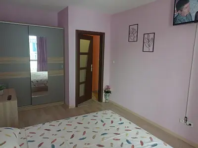 a room with a bed and a door to a bedroom at Апартамент Spirit in Nesebar