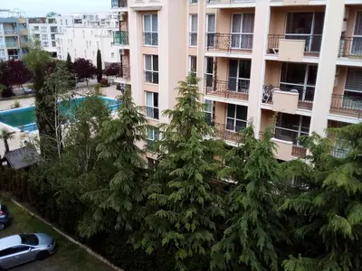 an apartment building with trees in front of it at SUNNY VIEW CENTRAL 3401 Studio Sunny Beach in Sunny Beach