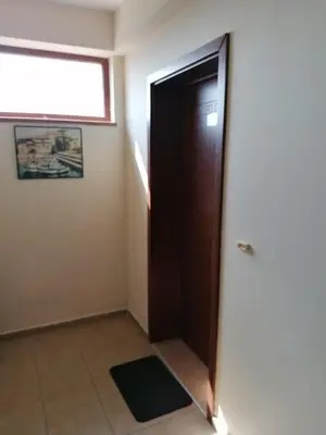 a room with a door and a window at Апартамент - студио в кв Сарафово с морски изглед in Burgas City