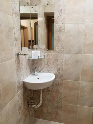 a bathroom with a sink and a mirror at Анси in Pomorie