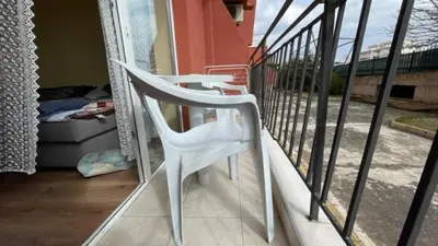 a white chair sitting on top of a balcony at AFRODITA I 108 Studio Sunny Beach in Sunny Beach