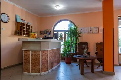 a kitchen with an island in the middle of a room at Хотел Бриз in Kiten