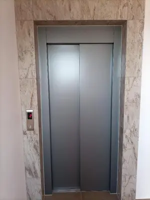a elevator in a building with a stone wall at Hotel Vanilla, Varna - Free parking in Varna City
