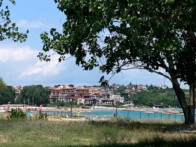 a view of a swimming pool with buildings in the background at Apartment at St. Nicholas Complex-Igora in Chernomorets