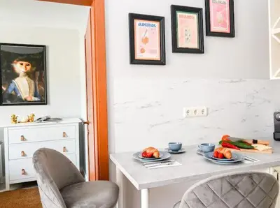a room with a table with plates of fruit on it at Nessebar Fort Club - Prestige Apartments in Sunny Beach